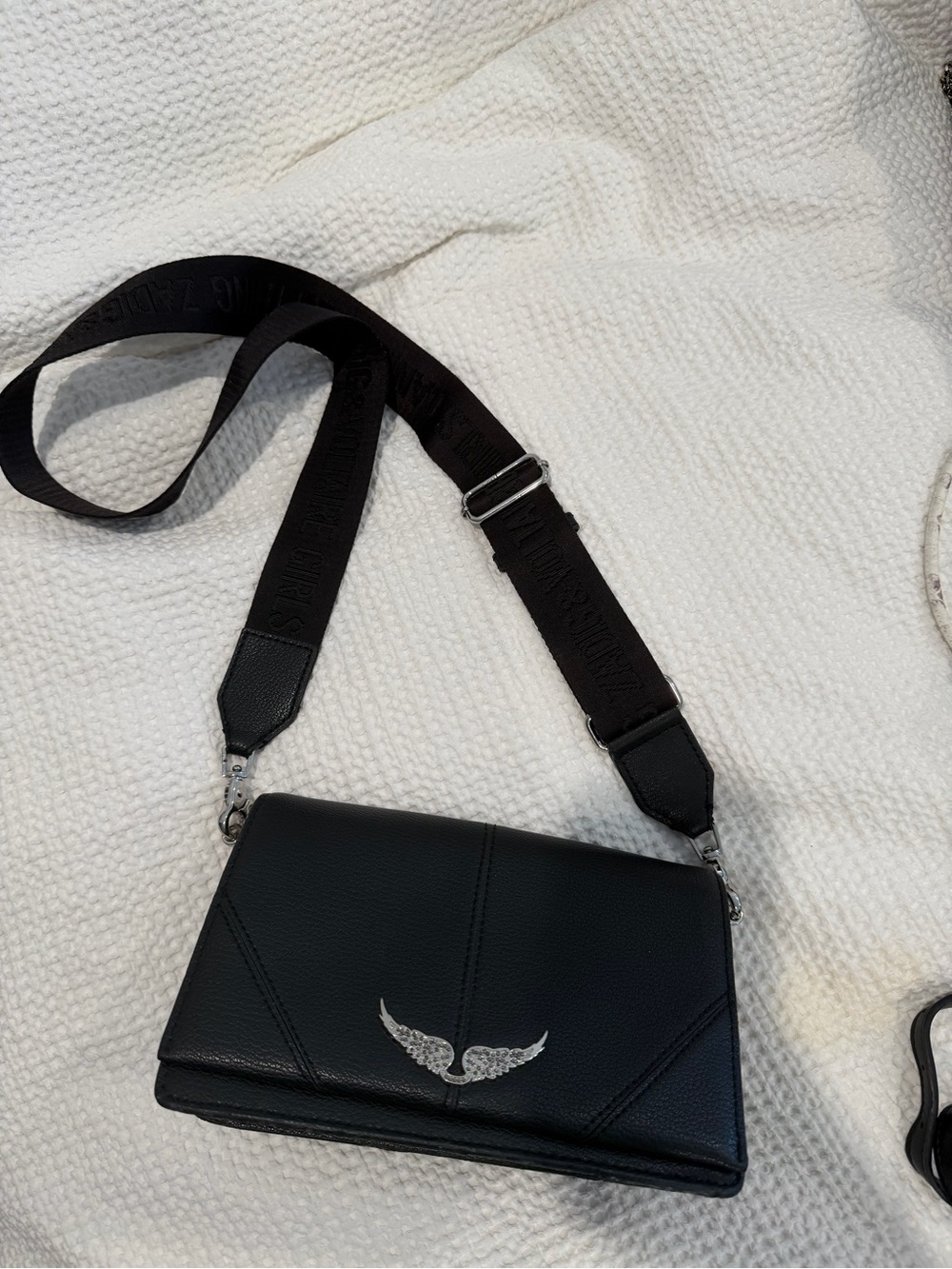 Black Leather Crossbody Bag with Silver Wing Emblem